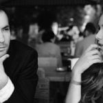 First date questions to ask on a date symbolized by two people talking to each other